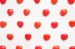 Red Valentine's Day Heart Shape Candy Pattern On Empty White Paper Background. Love Concept. Colorful Hipster Style. Knolling Top View Stock Photo