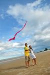 Couple Flying Kite Stock Photo