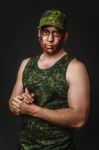 Creative And Funny Military Style Camouflage On Tankman Face Stock Photo