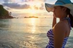 Girl On The Beach At Sunrise Stock Photo