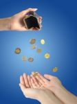 Coins And Hands Stock Photo