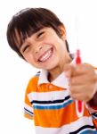 Happy Young Boy Showing The Toothbrush Stock Photo