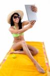 Pretty Young Girl With Green Bikini Taking Selfies With Her Digi Stock Photo