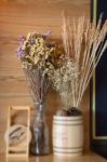 Ornamental Basket Of Wheat On Wooden Table Stock Photo