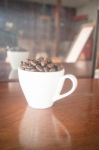 Roast Coffee Bean In White Mug Stock Photo