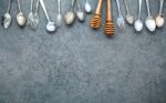 Various Cooking Utensils Border. Spoons And Fork On Dark Stone B Stock Photo