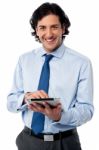 Young Businessman Operating Tablet Device Stock Photo