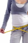 Female Measuring Her Waist With Tape Stock Photo