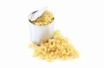 Dry Macaroni From Tin Can On White Background Stock Photo