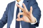 Businessman With Ok Sign Hand Gesture Isolated Stock Photo