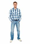 Smiling Young Man Standing On White Stock Photo