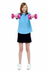 Slim Girl Striking A Pose With Dumbbells. Lifting Weights Stock Photo