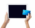 Human Hands Holding Tablet Pc And Credit Card Stock Photo