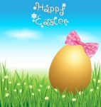 Golden Easter Eggs On Green Grass Stock Photo