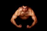 Bodybuilder Showing His Strength Stock Photo