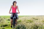 Fit Woman Riding Mountain Bike Stock Photo