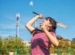 Young Beautiful Woman Playing Badminton Stock Photo