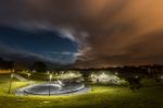 Full Moon Night Among Clouds From The Town Of Ribadeo, Spain Stock Photo