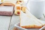 Bread In Plate On Table Stock Photo