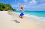 Girl Jumping With Happy On The Beach At Thailand Stock Photo