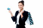 Businesswoman With Shopping Bag And Cash Card Stock Photo