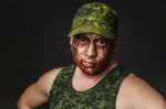 Military Style Camouflage On The Soldier's Face Stock Photo