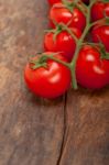 Fresh Cherry Tomatoes On A Cluster Stock Photo