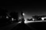 Boy Standing On A Mailbox At Night Stock Photo