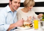 Couple Enjoying Dinner Stock Photo