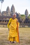 An Unidentified Old Buddhist Female Monk Dressed In Orange Toga Stock Photo