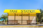 Yellow Taxi Station At Coast In Greece Stock Photo