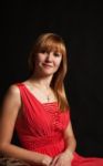 Portrait Of A Beautiful Woman In A Red Dress Stock Photo