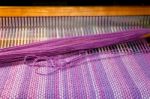 Detail Of Fabric In Comb Loom With Ultraviolet And Lilac Colors Stock Photo