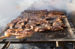 Traditional Meat Grilled On The Grill In The Argentine Countryside Stock Photo