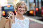 Trendy Woman Holding Shopping Bags Stock Photo