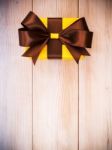 Gift Box On The Wooden Board Stock Photo