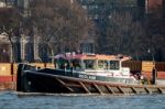 Reclaim Pulling Containers Down The River Thames Stock Photo