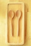 Two Wooden Spoons On Tray Stock Photo