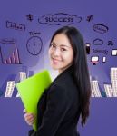 Young Business Woman Has Many Ideas On Business Background Stock Photo