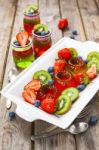 Red And Green Jelly Served With Fruit Stock Photo