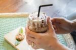 Hand On Iced Chocolate Drink Stock Photo