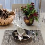 Earth Tone Table Set With Flower In Dinning Room Stock Photo