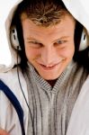 Young Handsome Man Enjoying Music With Headphones Stock Photo