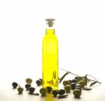 Bottle Of Olive Oil With Olives Stock Photo