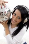 Portrait Of Smiling Female Holding Disco Mirror Ball Stock Photo