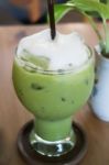 Iced Green Tea Latte With Milk Foam Stock Photo