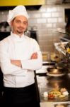 Young Male Chef Posing With Confidence Stock Photo