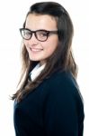 Smiling schoolgirl wearing glasses Stock Photo