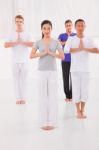 Multi Ethnic Group Of Happy People Doing Yoga Stock Photo