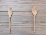 Top View Of Wood Spoon And Fork On Wooden Table Stock Photo